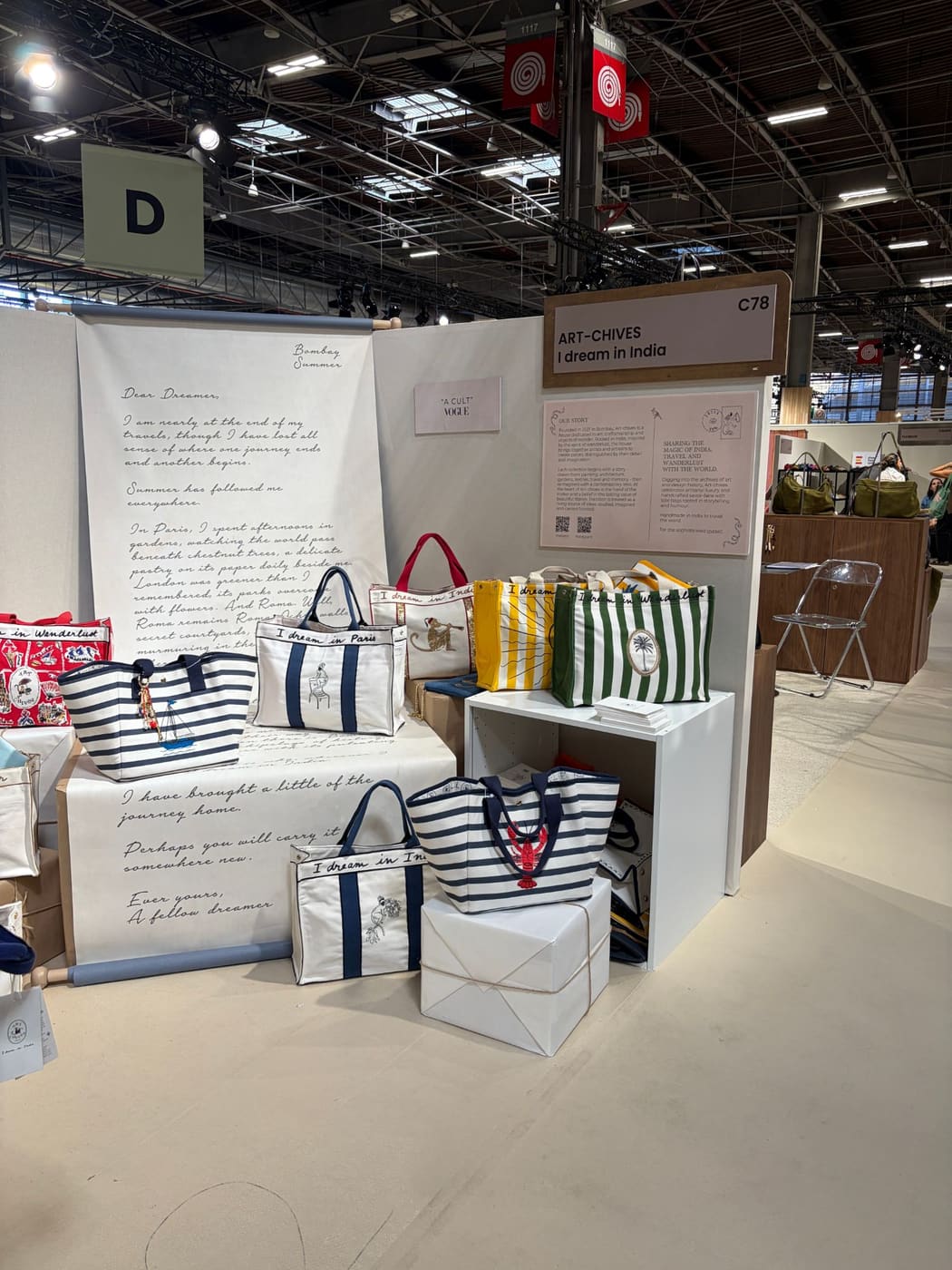 The Art-chives stand C78 at Who's Next September 2026: I dream in India tote bags, a Dear Dreamer letter printed on a scroll, and the brand story panel.