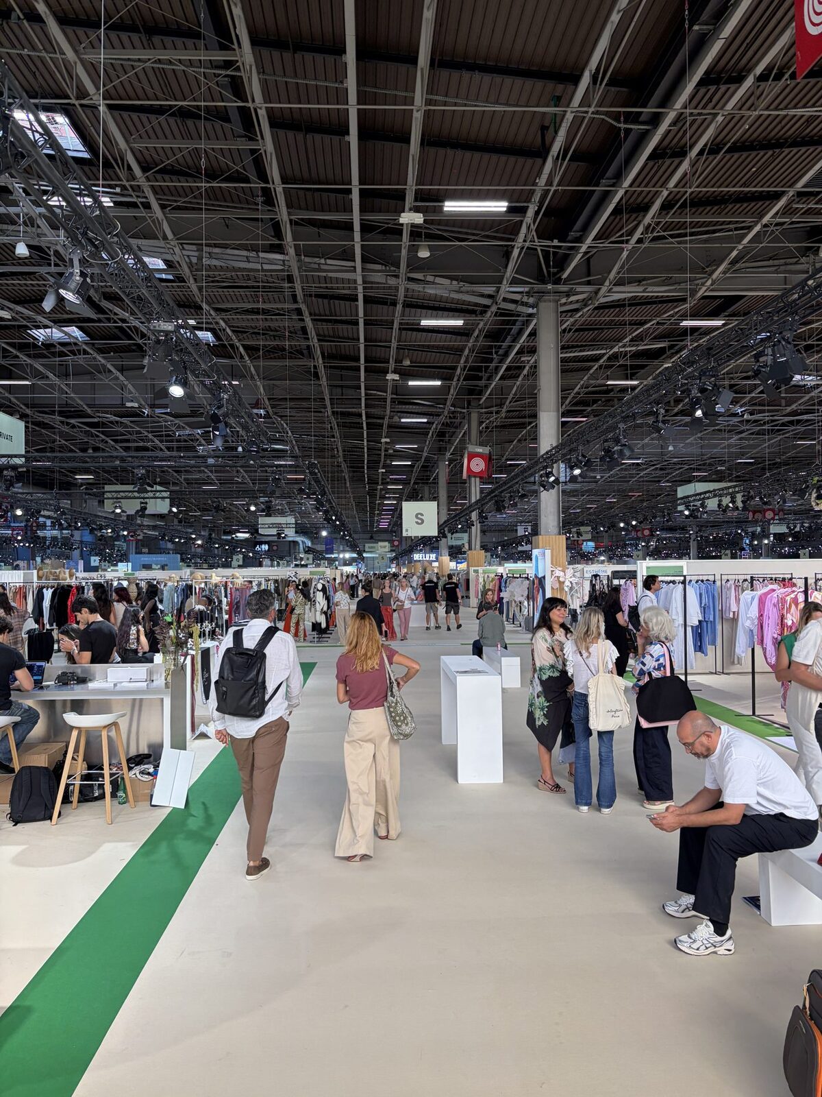 Buyers walking the main aisle at Who's Next, Porte de Versailles, Paris.