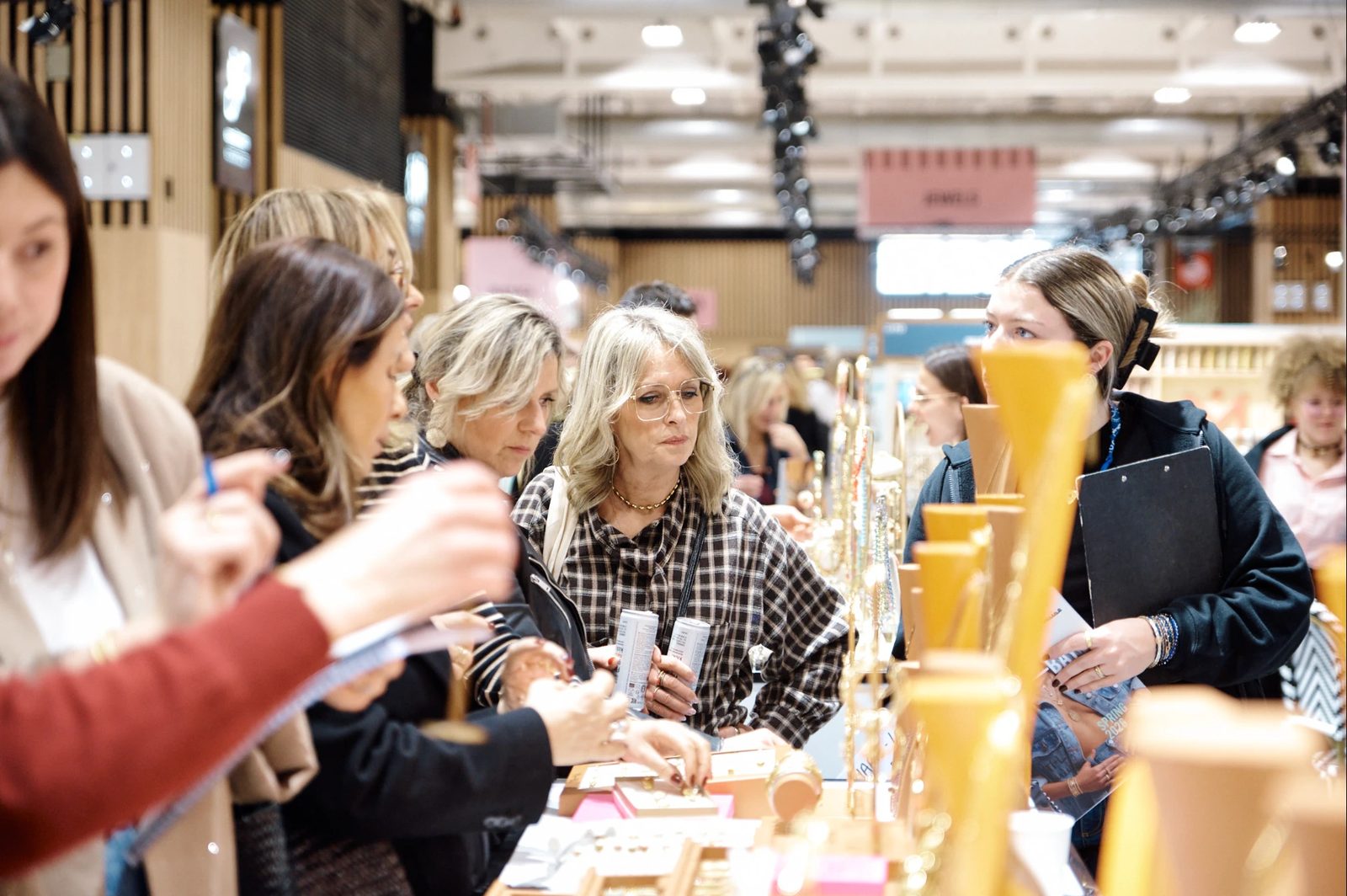 Buyers gathered around an accessories and jewellery stand at Who's Next, Paris.